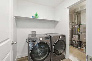 Laundry room with included washer and dryer