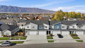 Aerial perspective of suburban area with a mountain backdrop