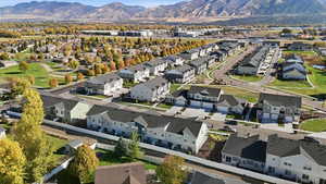 Aerial perspective of suburban area featuring a mountainous background