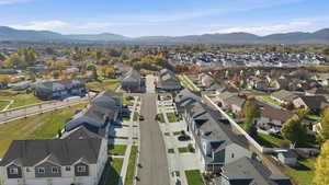 Aerial perspective of suburban area with a mountain backdrop