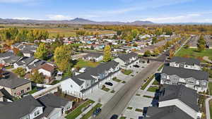 Aerial perspective of suburban area with a mountain backdrop