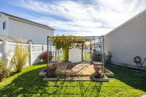 Fenced backyard with a patio area