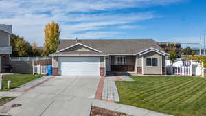 Single story home featuring a porch, concrete driveway, a shingled roof, brick siding, and a garage