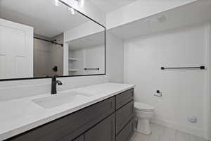 Bathroom with vanity and a shower