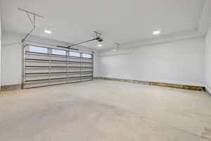 Garage featuring baseboards