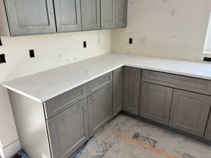 Kitchen with light stone counters