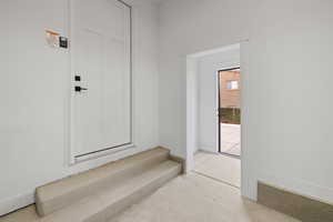 Garage entrance to the butler pantry and exterior side entrance to garage.