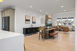 Dining space featuring recessed lighting and light wood-style flooring