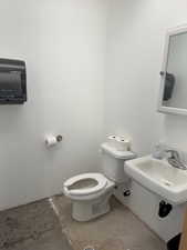 Bathroom featuring toilet and a sink