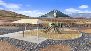 Community playground featuring a mountain view