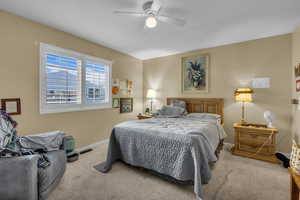Bedroom featuring carpet floors and ceiling fan