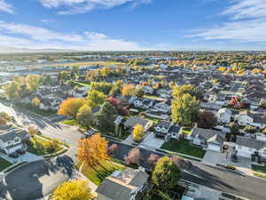 Aerial view of residential area featuring a mountainous background