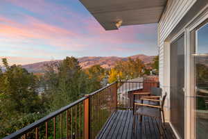 Balcony at dusk with a mountain view