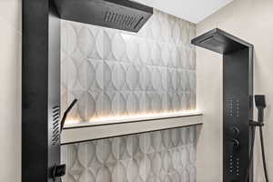 Bathroom view of a tile shower