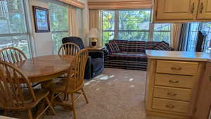 Dining area with light colored carpet