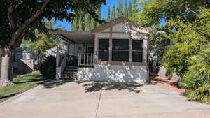 View of front of house with covered porch