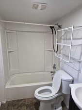 Bathroom with vanity and bathtub / shower combination