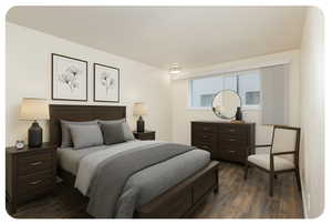 Bedroom featuring dark wood-style floors (virtually staged)