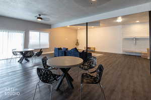 Dining area with a textured ceiling, dark wood finished floors, a ceiling fan, and recessed lighting