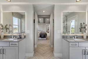 Bathroom with two vanities, recessed lighting, ensuite bath, and a shower stall