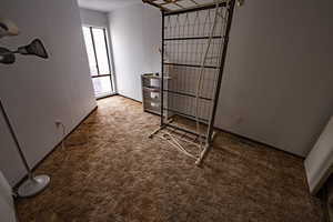Carpeted bedroom featuring baseboards
