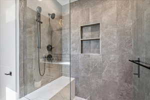 Full bath with a tile shower