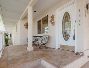 Property entrance featuring stucco siding