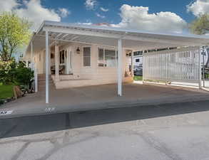 View of patio with an attached carport