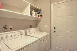 Laundry room featuring independent washer and dryer