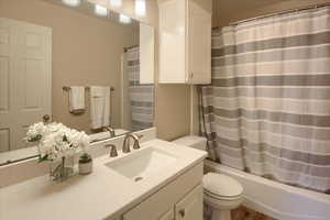 Full bath featuring vanity and shower / tub combo