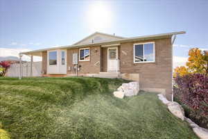 View of front of house featuring brick siding