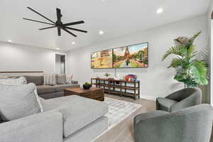 Living area featuring recessed lighting, wood finished floors, and ceiling fan