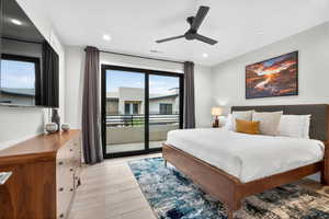 Bedroom with access to exterior, light wood-type flooring, ceiling fan, and recessed lighting