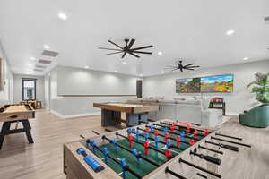 Recreation room featuring a ceiling fan and recessed lighting