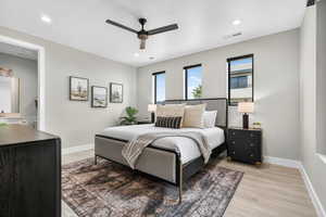 Bedroom featuring light wood-style floors, recessed lighting, and ceiling fan