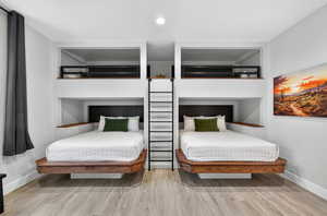 Bedroom featuring recessed lighting and light wood-style flooring