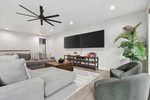 Living area featuring recessed lighting, wood finished floors, and ceiling fan