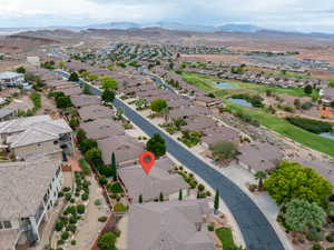 Aerial perspective of suburban area featuring a water and mountain view and a local golf course