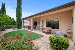 Back of property with stucco siding and a patio area