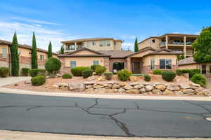 Traditional home with brick siding and stucco siding