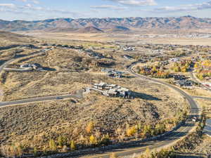 Aerial view of property's location with mountains and rural landscape