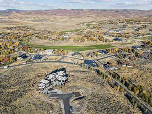 View of property location with a mountain backdrop and nearby suburban area