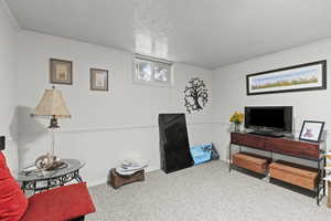 Bedroom with carpet and a textured ceiling