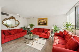 Community gathering room with lovely sunlight and access to the pool.