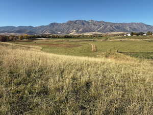 View of mountain backdrop featuring rural landscape