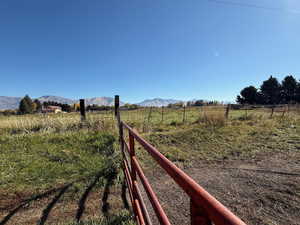 View of yard featuring a view of countryside and a mountain view