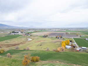 Aerial view of property's location featuring rural landscape and a mountain backdrop