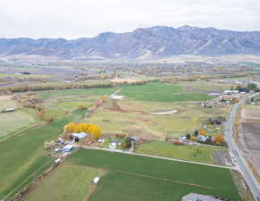 Aerial view of property and surrounding area with mountains