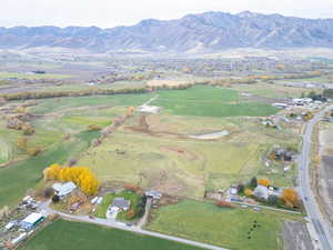 Aerial overview of property's location featuring a mountain backdrop