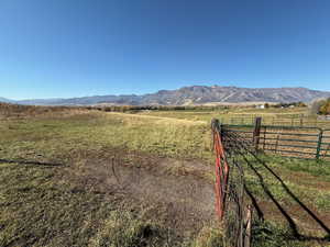 View of mountain background featuring rural landscape and agricultural land